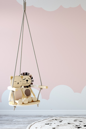 Early Years Concierge Service Image with Teddy Lions Sitting on Wooden Indoor Swing with Warm Pink Wall With Cloud Design
